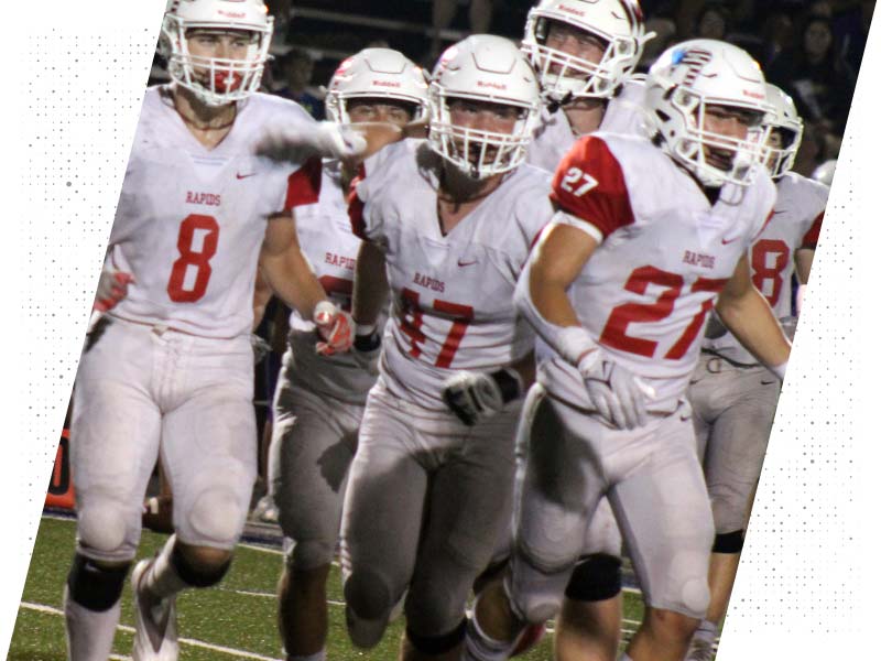 Wisconsin Rapids Football Players rush back to field after huddle