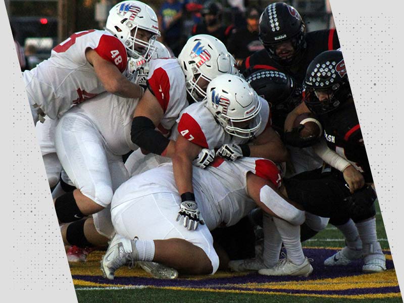 Wisconsin Rapids Football team defensive line tackles opponents running back