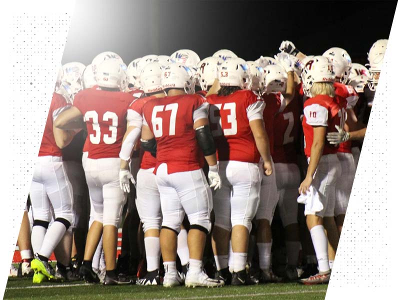 Wisconsin Rapids Football team huddles and breaks